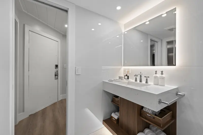 Floating vanity with backlit mirror