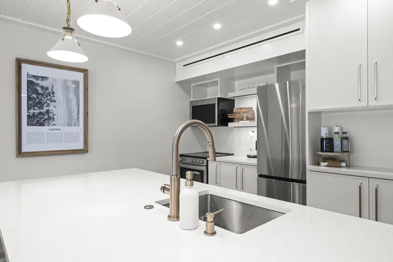 Brushed-gold faucet and quartz countertops