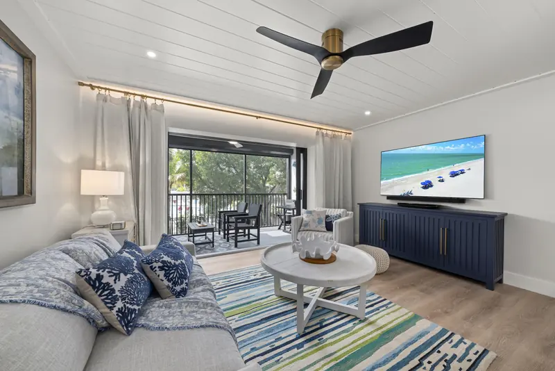 Designer living room opening to the private screened lanai