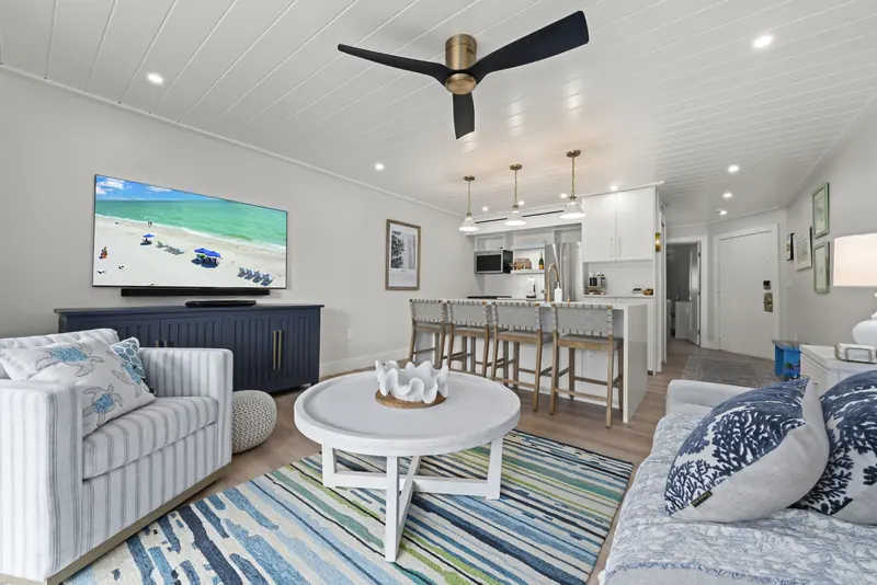 Living room with sleeper sofa and kitchen beyond